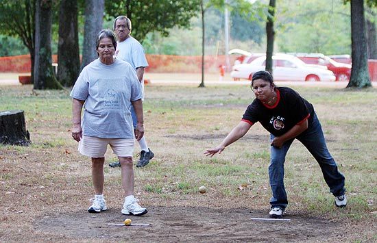 Two women in Cherokee marbles game