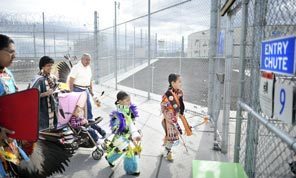 Powwow visitors, including children for the first time in years, enter the state penitentiary in Walla Walla last Tuesday. 