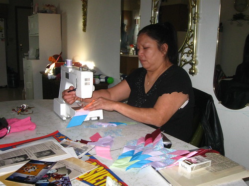 Woman sewing star quilt