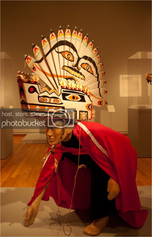 Nuu-chah-nulth Wolf Headdress, Early 20th centuryPlywood, paint, string, thread spools, fabric, cedar twigsWashington State Historical Society, catalog no. 1999.105.1 (Smithsonian)