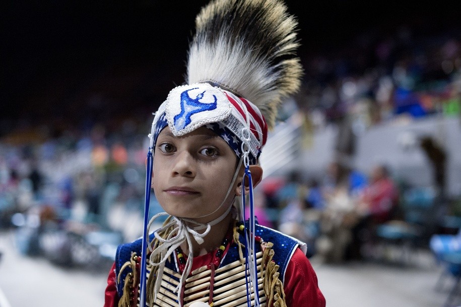 David Cyrus, 8, of the Crow Nation poses for a portrait prior to the Grand Entry during the Denver March Powwow on March 24, 2017 in Denver, Colorado. .Held over four days, the Denver March Powwow attracts an estimated 55,000 participants, made up of dancers, drummers, vendors, and spectators. Since 2009 roughly 95 nations, 35 US states, and five Canadian provinces have been represented during the powwow. / AFP PHOTO / Jason Connolly (Photo credit should read JASON CONNOLLY/AFP/Getty Images)