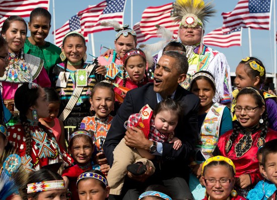President Barack Obama and First Lady Michelle Obama attend the Cannon Ball Flag Day Powwow in Cannon Ball, North Dakota, June 13, 2014..(Official White House Photo by Pete Souza)..